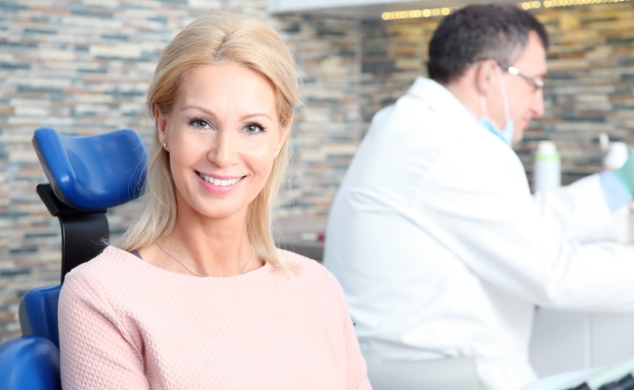 Beautiful Women Sitting On Dental Chair Taking The Dental Services